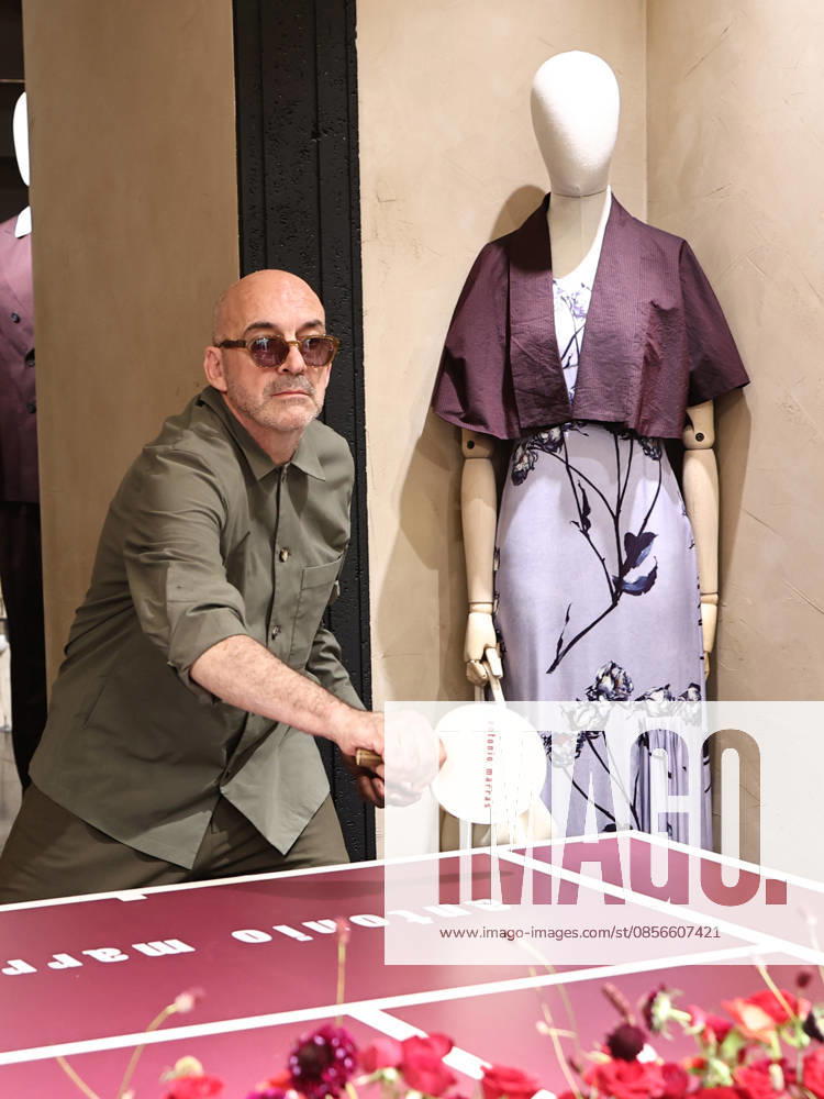 IPA84680223 - Rome, Laila Hasanovic attends the Antonio Marras boutique event. Pictured: Antonio Marras plays ping pong.