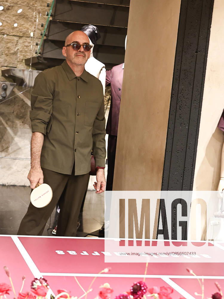 IPA84680216 - Rome, Laila Hasanovic attends the Antonio Marras boutique event. Pictured: Antonio Marras plays ping pong.