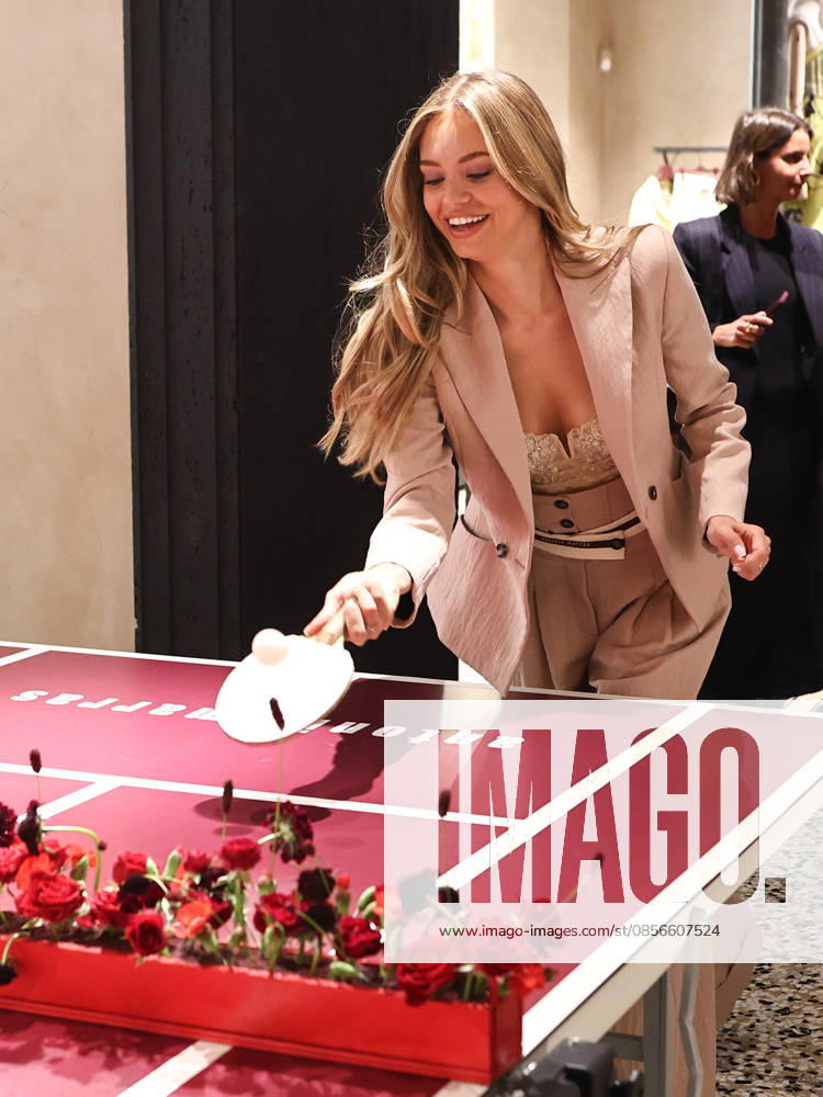 IPA84680186 - Rome, Laila Hasanovic attends the Antonio Marras boutique event. Pictured: Laila Hasanovic plays ping pong.