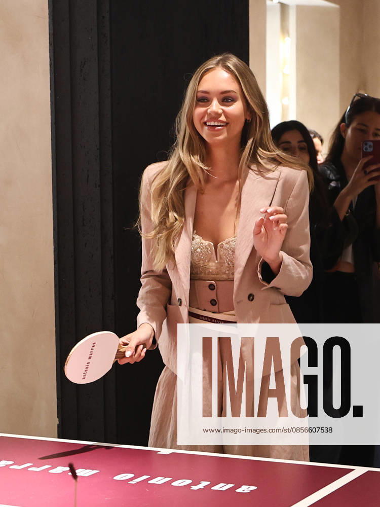 IPA84680196 - Rome, Laila Hasanovic attends the Antonio Marras boutique event. Pictured: Laila Hasanovic plays ping pong.