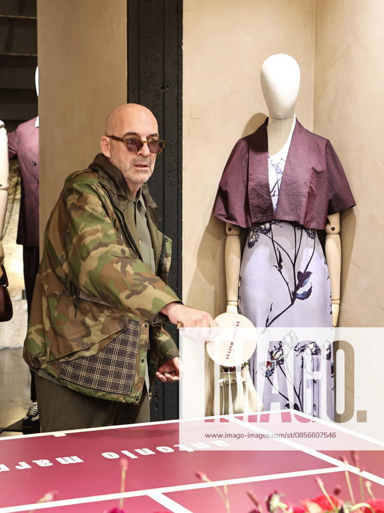 IPA84680204 - Rome, Laila Hasanovic attends the Antonio Marras boutique event. Pictured: Antonio Marras plays ping pong.