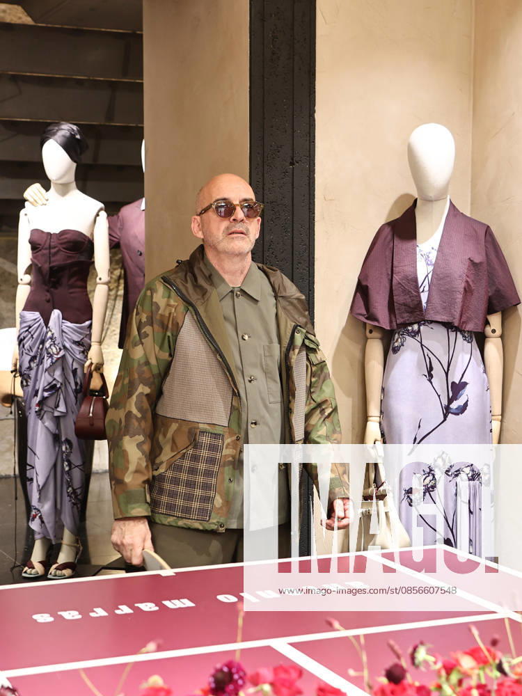 IPA84680206 - Rome, Laila Hasanovic attends the Antonio Marras boutique event. Pictured: Antonio Marras plays ping pong.