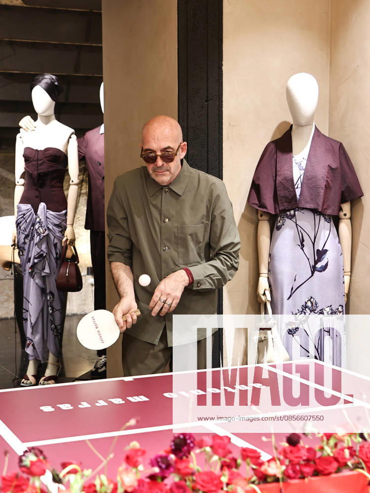 IPA84680208 - Rome, Laila Hasanovic attends the Antonio Marras boutique event. Pictured: Antonio Marras plays ping pong.