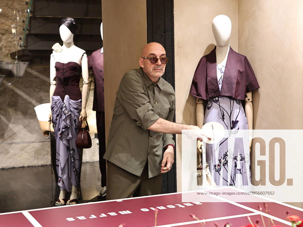 IPA84680210 - Rome, Laila Hasanovic attends the Antonio Marras boutique event. Pictured: Antonio Marras plays ping pong.