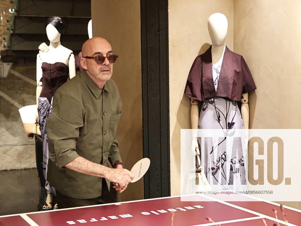 IPA84680218 - Rome, Laila Hasanovic attends the Antonio Marras boutique event. Pictured: Antonio Marras plays ping pong.