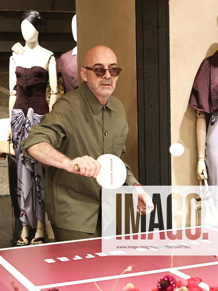IPA84680220 - Rome, Laila Hasanovic attends the Antonio Marras boutique event. Pictured: Antonio Marras plays ping pong.