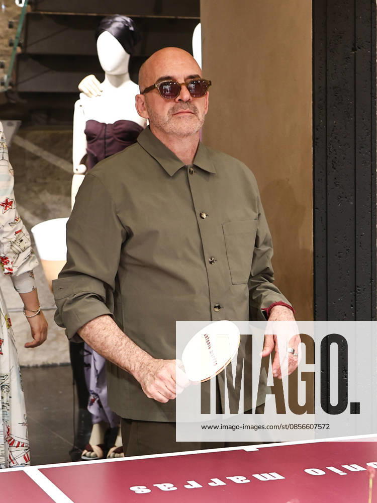 IPA84680221 - Rome, Laila Hasanovic attends the Antonio Marras boutique event. Pictured: Antonio Marras plays ping pong.
