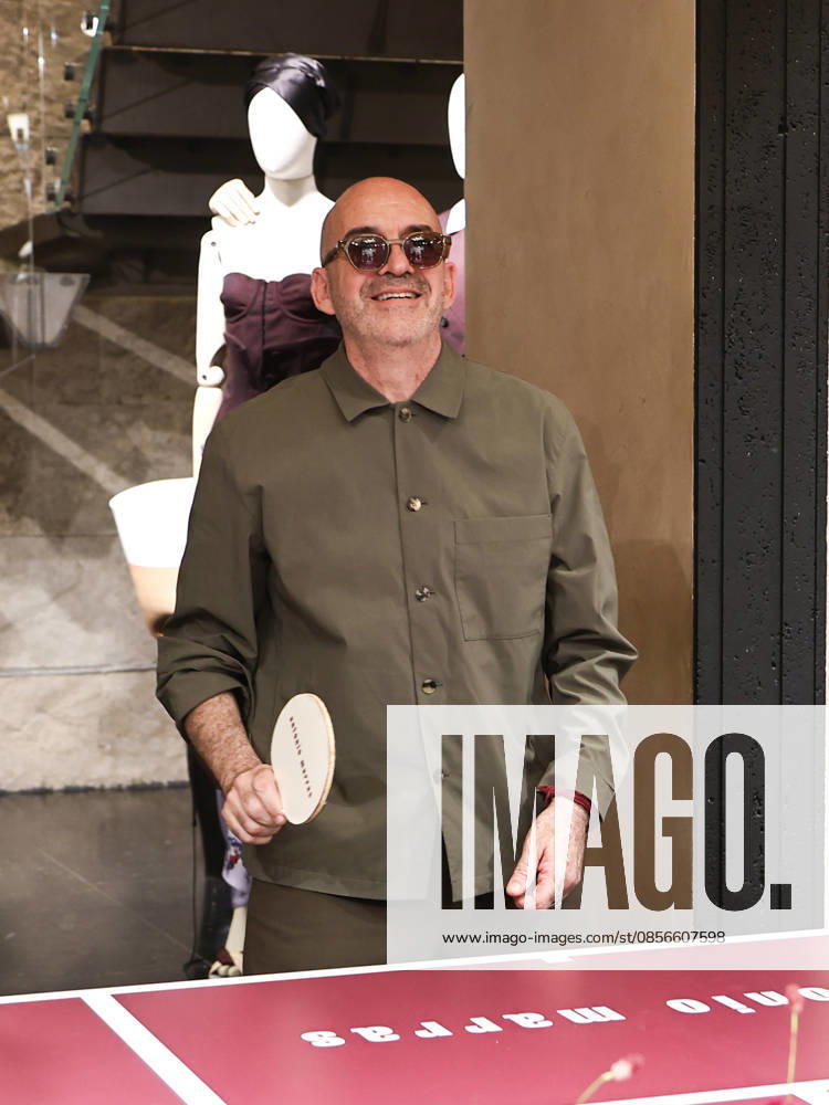 IPA84680225 - Rome, Laila Hasanovic attends the Antonio Marras boutique event. Pictured: Antonio Marras plays ping pong.
