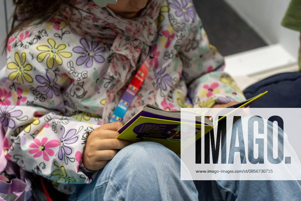 Some moments from the second day of the International Book Fair. Pictured is a little girl reading a book. Turin, May 15, 2026 Turin Italy - ZUMAa289 20260515_zia_a289_016