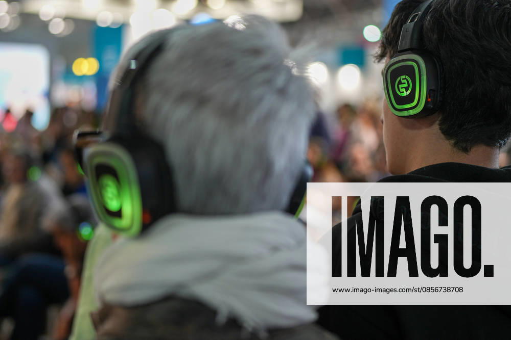 IPA84723878 - Turin. Second day of the 18th edition of the Turin International Book Fair entitled The World Saved by Kids. The fair will remain open from May 14 to 18, 2026 at Lingotto Fiere Pictured: audience listens to audiobooks