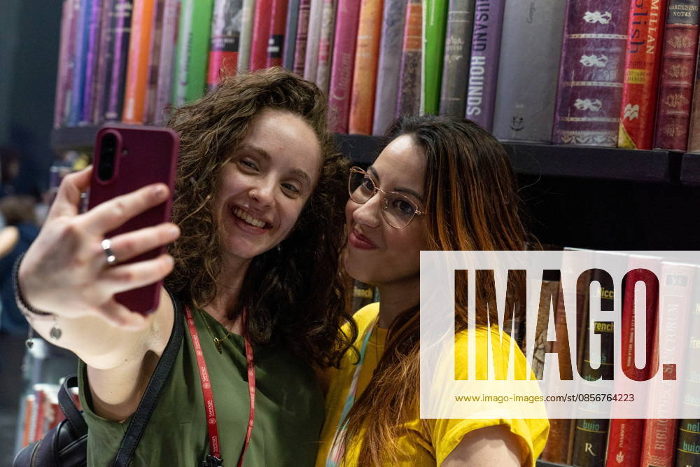 Some moments from the second day of the International Book Fair. Pictured are two young girls taking a selfie. Turin, May 15, 2026 Turin Italy - ZUMAa289 20260515_zia_a289_008
