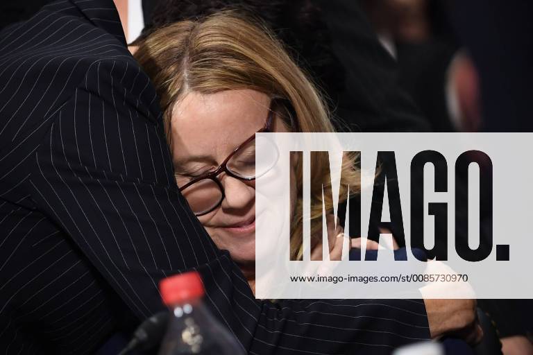 Christine Blasey Ford, the woman accusing Supreme Court nominee Brett Kavanaugh of sexually assaulting her at a party 36 years ago, is comforted by her attorney at the ned of her testimony before the US Senate Judiciary Committee on Capitol Hill in Washington, DC, September 27, 2018. WAX2080927331 SAULxLOEB