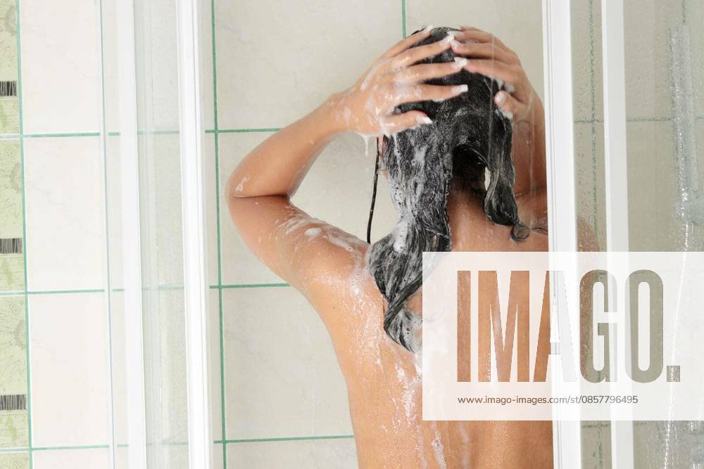 Young woman in shower washing her hairs model released Symbolfoto