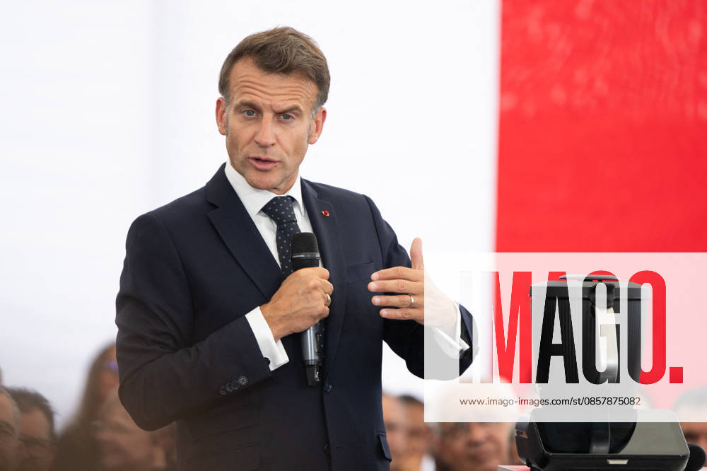 French President Emmanuel Macron speaks in front of a French flag during a visit to the Vorwerk factory producing Thermomix kitchen appliances as part of the Choose France Days in Donnemain Saint Mames, France, on May 29, 2026 Grégoire Campione Pool Bestimage French President Emmanuel Macron visits the Vorwerk factory producing Thermomix kitchen appliances as part of the Choose France Days in Donnemain Saint Mames, France, on May 29, 2026 Donnemain Saint Mames France