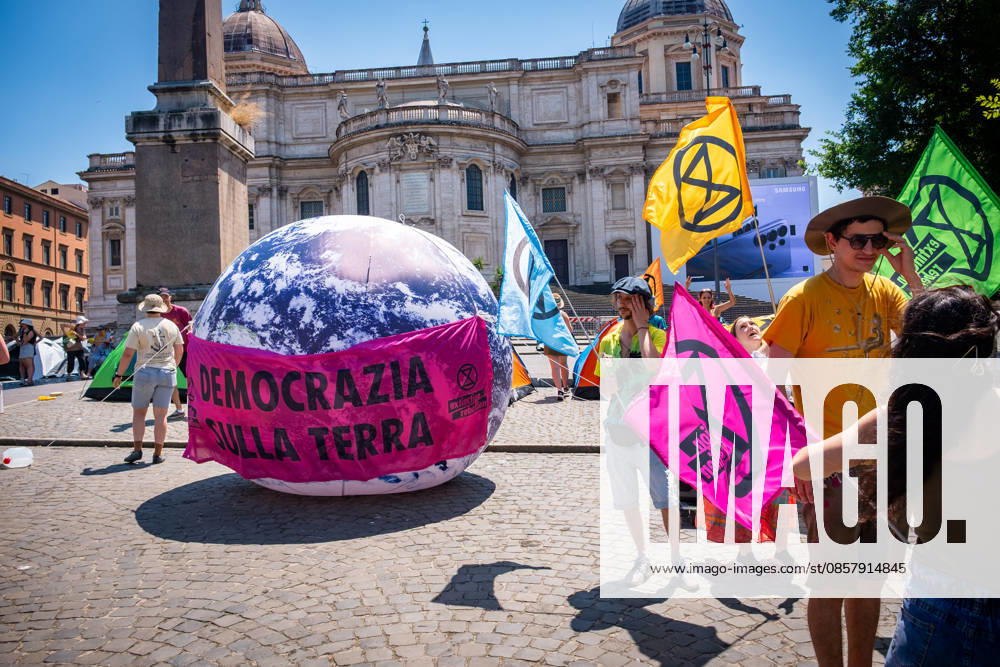 Extinction Rebellion activists are launching a 24-hour rally in Piazza dell Esquilino, just days before the 80th anniversary of the Italian Republic on June 2nd. They say: there is nothing to celebrate as long as rights, justice, and dignity continue to be denied. Oil extraction is imposed through violence and war to produce ever more energy, further increasing inequality. Democracy on earth reads the banner. Rome Italy - ZUMAg256 20260530_znp_g256_004