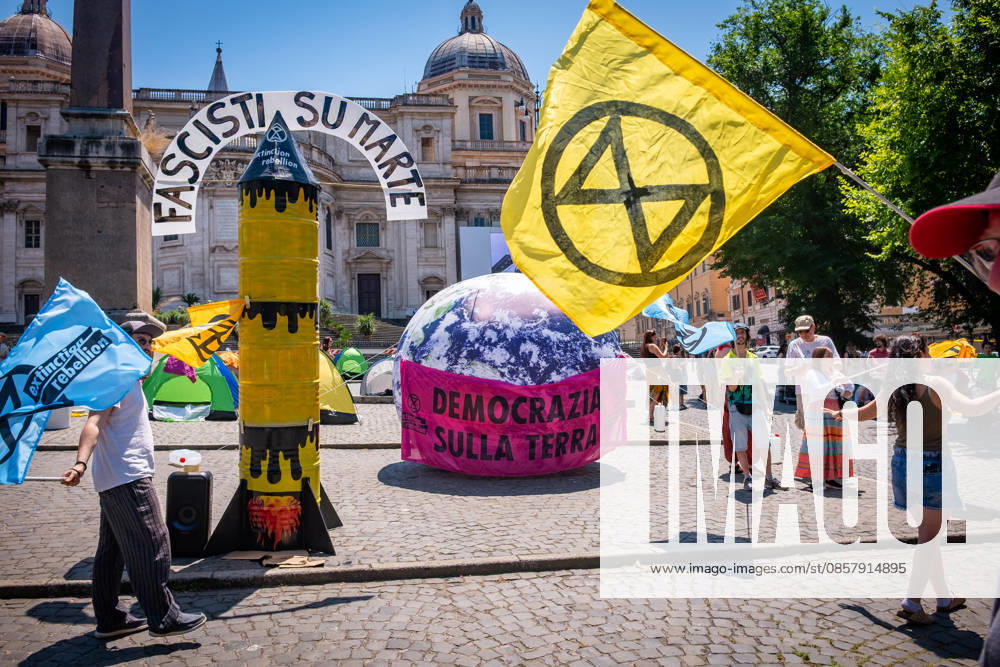 Extinction Rebellion activists are launching a 24-hour rally in Piazza dell Esquilino, just days before the 80th anniversary of the Italian Republic on June 2nd. They say: there is nothing to celebrate as long as rights, justice, and dignity continue to be denied. Oil extraction is imposed through violence and war to produce ever more energy, further increasing inequality. Activists assembled a rocket made of oil drums. It reads: Fascists on Mars. Democracy on earth reads the banner. Rome Italy - ZUMAg256 20260530_znp_g256_007