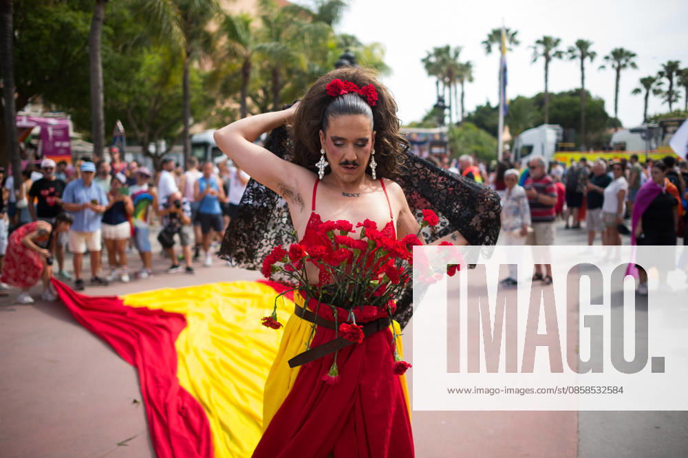 A person wearing a dress with the spanish flag is seen holding roses as he .takes part in a demonstration in support of the rights of LGTBIQ+ people, as part of the LGTBIQ+ Pride celebrations. The LGTBIQ+ Pride of Torremolinos is internationally known as a meeting point for LGTBIQ+ people in a colourful and festive atmosphere, where thousands of people celebrate the fight of the LGTBIQ+ movement for equality and respect. Malaga Spain - ZUMAs197 20260606_aaa_s197_319