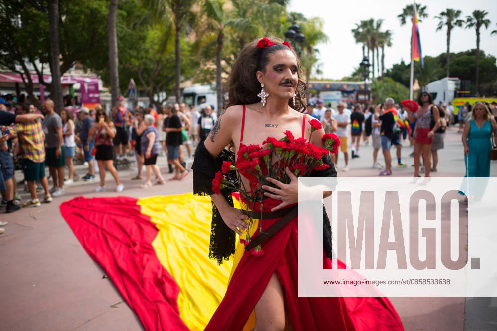 A person wearing a dress with the spanish flag is seen holding roses as he .takes part in a demonstration in support of the rights of LGTBIQ+ people, as part of the LGTBIQ+ Pride celebrations. The LGTBIQ+ Pride of Torremolinos is internationally known as a meeting point for LGTBIQ+ people in a colourful and festive atmosphere, where thousands of people celebrate the fight of the LGTBIQ+ movement for equality and respect. Malaga Spain - ZUMAs197 20260606_aaa_s197_384