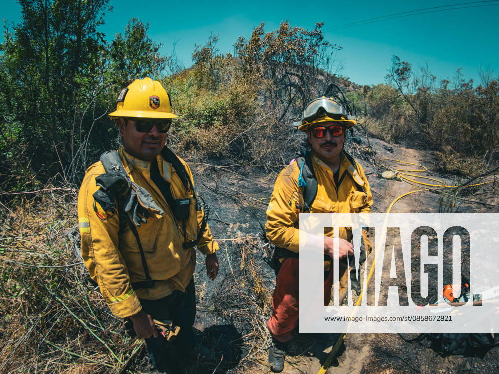 Fire crews battle a brushfire off Benet Rd. in Oceanside, California, on June 08, 2026. The Airport Fire temporarily placed evacuations order for nearby residents and businesses. Oceanside USA - ZUMAg219 20260608_znp_g219_001