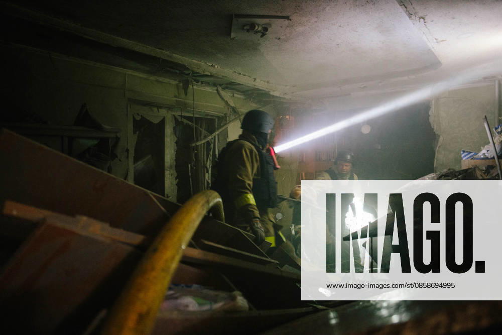 Consequences Of The Attack On Kharkiv Rescuers inspect a business center damaged in a military operation in Kharkiv, Ukraine, on June 9, 2026. According to the mayor, residential buildings, a business center, restaurants, a church, and cars were damaged, and more than 15 people were injured by morning. Kharkiv Ukraine