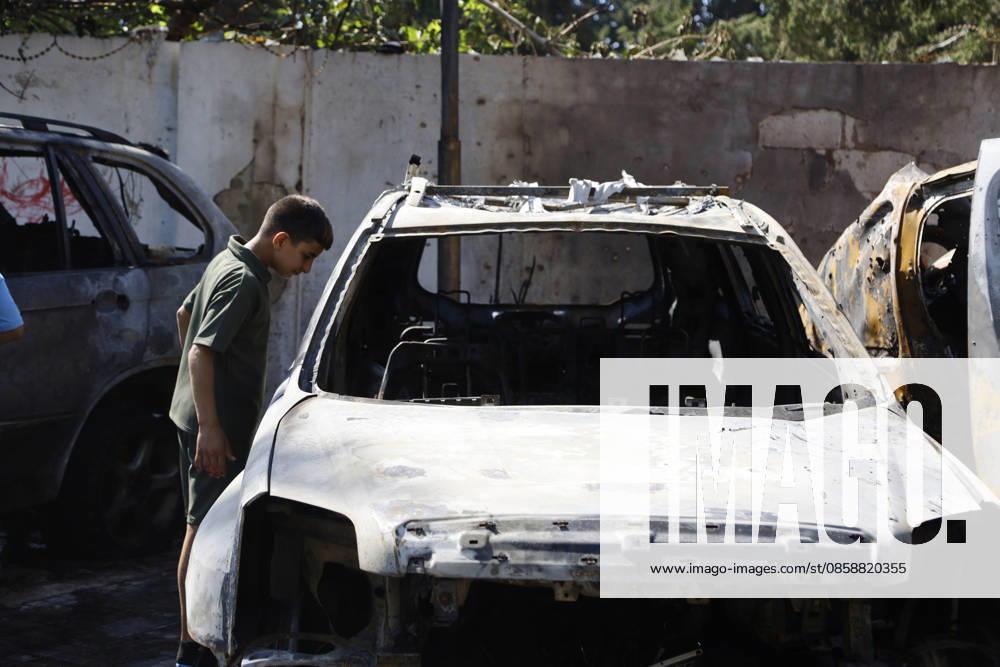 An Israeli drone strike targeted a van in the Al-Bawaba Al-Fawqa area adjacent to the commercial market in central Sidon (Saida), southern Lebanon, killing two people and igniting a fire that spread to several nearby vehicles. The attack occurred near the Maronite Church and a fuel station in a densely populated civilian area. Emergency responders and civil defense teams recovered the victims and worked to extinguish the blaze, which damaged at least four neighboring cars. Saida lebanon - ZUMAb339 20260610_znp_b339_002