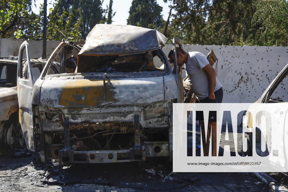 An Israeli drone strike targeted a van in the Al-Bawaba Al-Fawqa area adjacent to the commercial market in central Sidon (Saida), southern Lebanon, killing two people and igniting a fire that spread to several nearby vehicles. The attack occurred near the Maronite Church and a fuel station in a densely populated civilian area. Emergency responders and civil defense teams recovered the victims and worked to extinguish the blaze, which damaged at least four neighboring cars. Saida lebanon - ZUMAb339 20260610_znp_b339_003