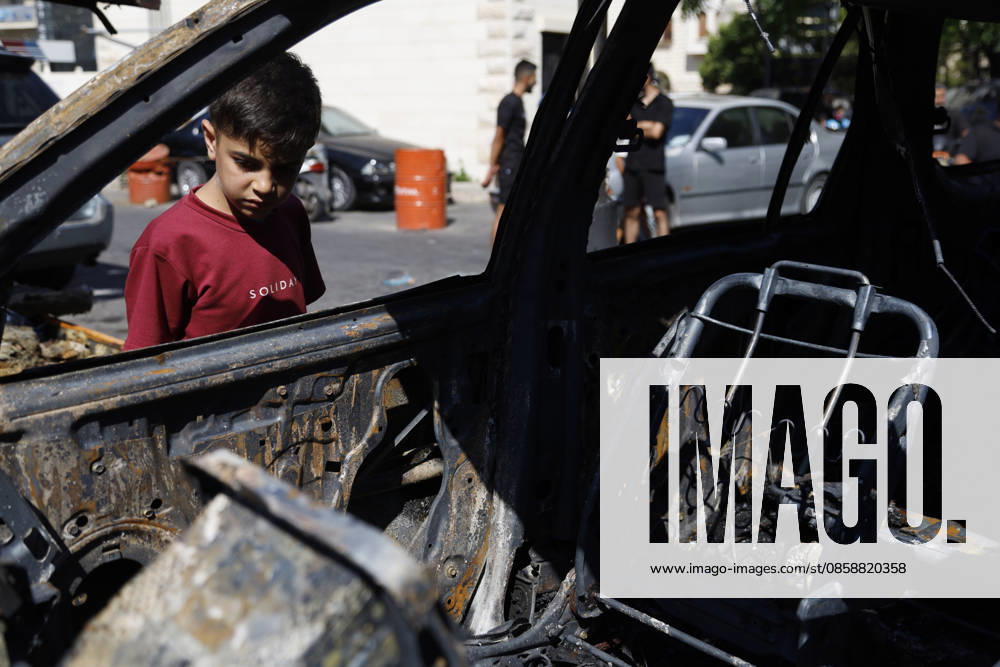 An Israeli drone strike targeted a van in the Al-Bawaba Al-Fawqa area adjacent to the commercial market in central Sidon (Saida), southern Lebanon, killing two people and igniting a fire that spread to several nearby vehicles. The attack occurred near the Maronite Church and a fuel station in a densely populated civilian area. Emergency responders and civil defense teams recovered the victims and worked to extinguish the blaze, which damaged at least four neighboring cars. Saida lebanon - ZUMAb339 20260610_znp_b339_004