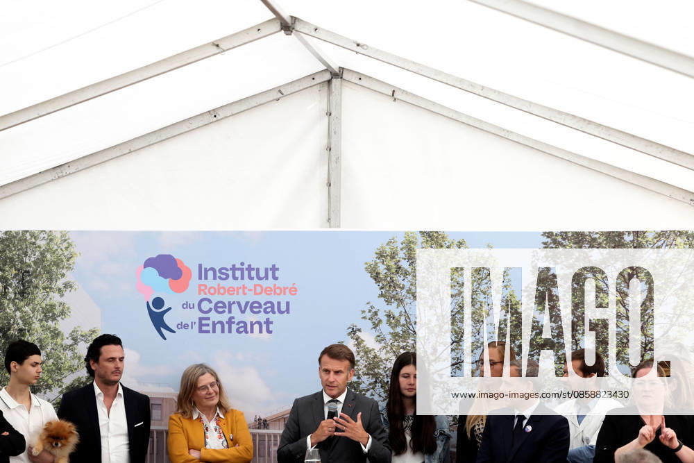 Emmanuel Macron and Brigitte Macron Visit the Robert-Debre Hospital - Paris French President Emmanuel Macron delivers a speech next to Adrien Taquet, Chairman of the Supervisory Board of the Robert-Debre Institute for the Child s Brain and Professor Ghislaine Dehaene during the foundation stone laying ceremony for the Child Brain Institute (ICE - Institut Robert-Debre du Cerveau de l’Enfant) at the Robert-Debre Hospital in Paris, on June 10, 2026. Photo by Stephane Lemouton Pool ABACAPRESS.COM Paris France