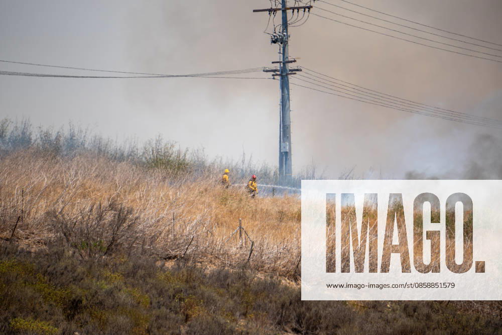 Fire crews battle the November Fire off Foussat Rd. in Oceanside, California, on June 10, 2026. Multiple resources were called to subdue the nearly 850 acre fire that borders Camp Pendleton and the Whelan Lake Audubon Society Preserve. Oceanside USA - ZUMAg219 20260610_znp_g219_003