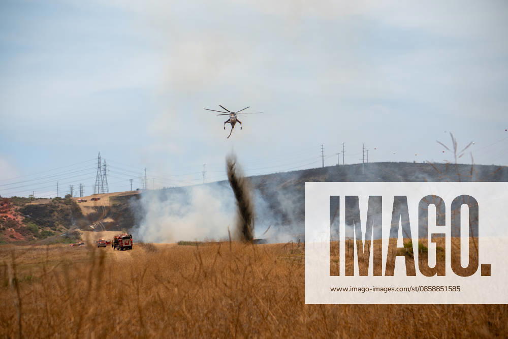 Fire crews battle the November Fire off Foussat Rd. in Oceanside, California, on June 10, 2026. Multiple resources were called to subdue the nearly 850 acre fire that borders Camp Pendleton and the Whelan Lake Audubon Society Preserve. Oceanside USA - ZUMAg219 20260610_znp_g219_002
