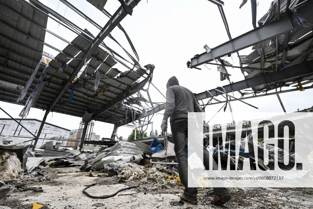A worker clears debris at the site of the Favoryt Arena ice sports palace, destroyed in Russian guided aerial bomb (KAB) strikes, in the frontline city of Kherson, Ukraine, on June 3, 2026. The Russian army attacks the city daily with FPV drones and other unmanned aerial vehicles, deliberately terrorizing civilians. Russian forces conduct hunts for local residents, tracking them with FPV drones and _drop_ping explosives. Police officers, medics, public transport, and urban infrastructure are also targeted (Photo by Dmytro Smolienko Ukrinform) Life under shelling in frontline Kherson