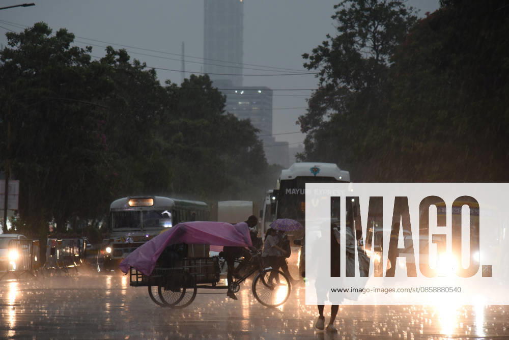 Monsoon Rain In Kolkata, India Commuters ride through a waterlogged street during heavy rainfall in Kolkata, India, on June 10, 2026. Kolkata India