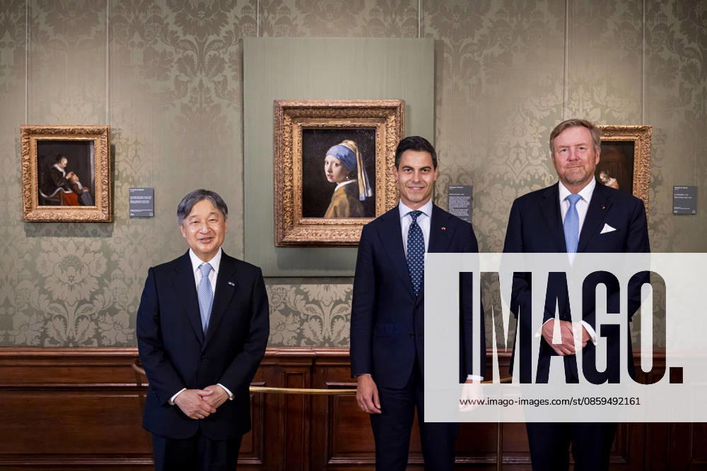 Statevisit King Willem-Alexander and Emperor Naruhito of Japan and Prime Minister Rob Jetten posing in front of the painting a Girl with a Pearl Earring by Johannes Vermeer (Meisje met de Parel van Johannes Vermeer) at the Mauritshuis in The Hague on the 2nd day of the 3 day statevisit to the Netherlands. Â