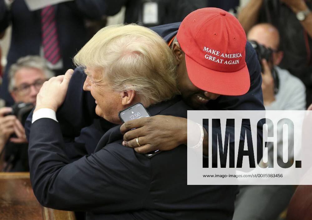 President Donald Trump hugs Kanye West during a meeting in the Oval office of the White House on October 11, 2018 in Washington, DC. Trump later signed the Music Modernization Act that protects copyrights in the digital age, in Washington, DC on October 11, 2018. Several musicians from all genres attended the ceremonies for the bi-partisan legislation that was highly anticipated in the music industry. WAX20181011202 OLIVERxCONTRERAS