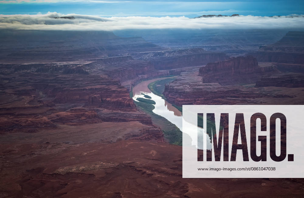 Dramatic aerial view of river winding through vast red canyon Moab, Utah, United States CR_EVVA260610-2047366-01