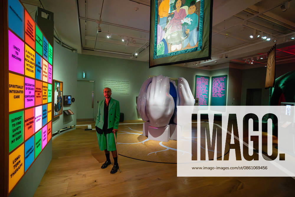 Rudy Loewe: Intimacies of Care at Wellcome Collection, London, UK 8 July 2026 Artist Rudy Loewe poses with their work at the preview of Rudy Loewe: Intimacies of Care Spaces of Grief and Possibility at the Wellcome Collection, London, UK, on 8 July 2026. The exhibition of new commissions advocates for Black people whose experience of mental health care in the UK is adversely impacted by racist discrimination, and reimagines a more equitable and supportive mental health care system, on view from 10 July 2026 until 7 February 2027., Credit:Pete Speller Avalon