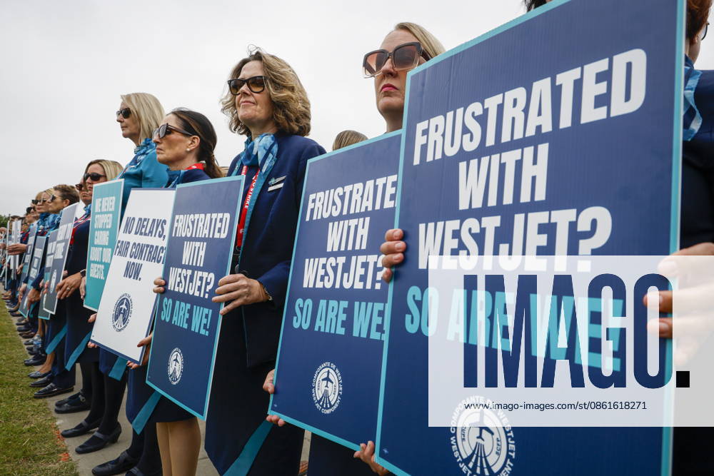 WestJet flight attendants hold a Day of Action while union members vote on a possible strike in Calgary, Tuesday, July 14, 2026. Calgary CANADA - ZUMAc35_ 20260714_zaf_c35_043