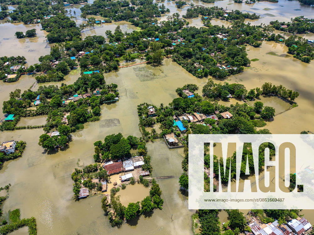 Aftermath Of Floodwaters In Chattogram A drone shot captures clusters of homes isolated like green islands amid massive sheets of standing floodwater in Banshkhali, Chattogram, Bangladesh, on July 14, 2026. Although the flood waters in Banshkhali and Satkania in Chittagong are slowly receding.Many areas are still knee-deep in water, and as the water recedes, collapsed mud houses, damaged structures, destroyed brick kilns and severely damaged agricultural land are becoming visible, displacing thousands of people and leaving them struggling to meet their basic needs. Chattogram Bangladesh
