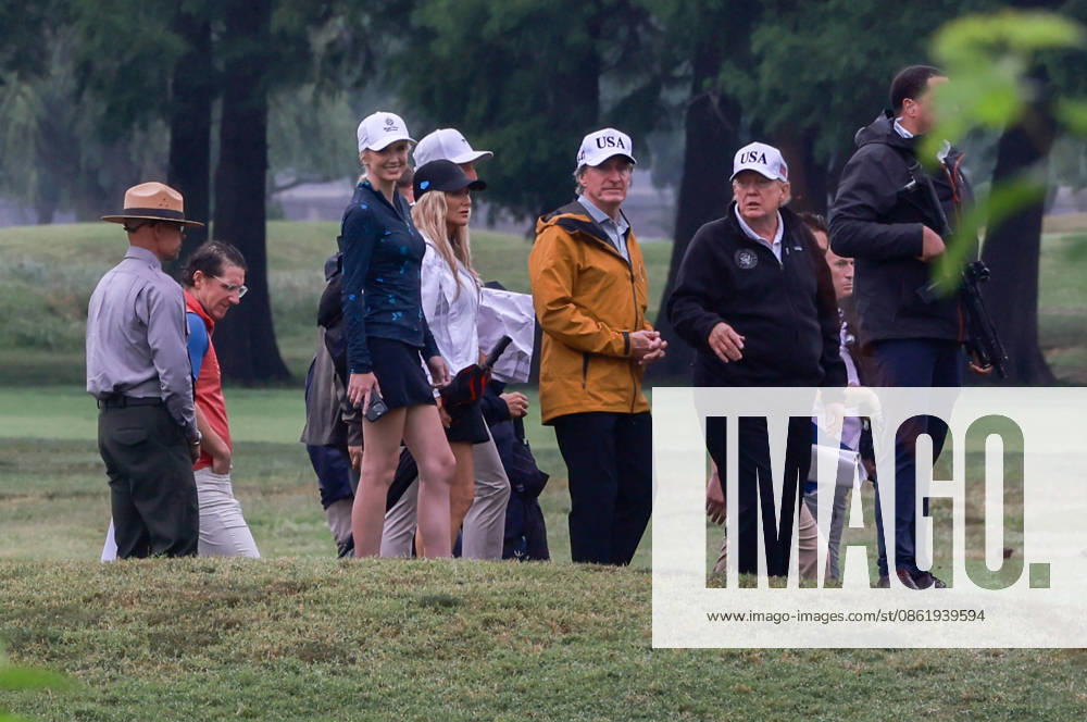 Trump DC Golf Course and Triumphal Arch Location Tour United States Secretary of the Interior and Chair, National Energy Council and White House Energy Czar Doug Burgum, center left, and US President Donald J Trump at East Potomac Golf Links in Washington, DC, US, on Sunday, June 28, 2026. Trump has taken a number of steps to reshape the nation’s capital in his second term, including demolishing the White House East Wing to make way for a new ballroom, planning for the construction of a new triumphal arch, pledging to renovate the John F. Kennedy Center for the Performing Arts, and terminating a contract to run a trio of public golf courses in Washington. Natalie Harp, Executive Assistant to the President joins the tour at third left. Cred