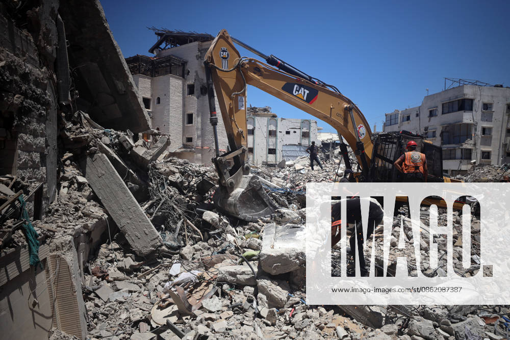 Aftermath of Israeli Airstrike In Gaza An excavator clears debris as civil defence teams search for the bodies of the Al-Hasayna family under the rubble of their home, which was destroyed by Israeli forces in December 2023, in Gaza City on July 19, 2026. Gaza remains subject to daily violence despite a formal ceasefire in place since October, with both the Israeli military and Hamas accusing one another of violating the truce. Gaza Palestine
