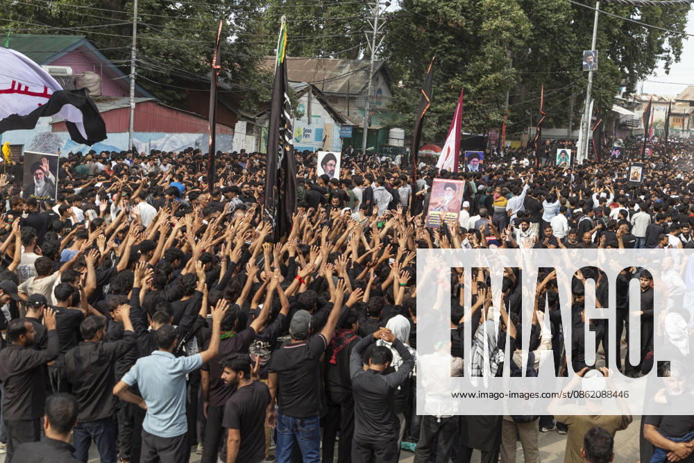 Shiite Muslims raise their hands and chant slogans in support of Iran during a religious procession on the fourth day of Safar in Magam. Safar, the second month of the Islamic calendar, follows Muharram and continues the mourning of Imam Hussain. According to Shia tradition, the 4th of safar, 61 AH, marks the imprisonment of the Prophet s household (Ahl al-Bayt) in Kufa under the orders of Ubaydullah ibn Ziyad after the Battle of Karbala. Budgam India - ZUMAa205 20260719_zip_a205_007