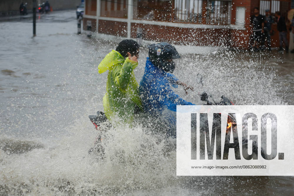 Monsoon Rains Inundate Roads In Central Kathmandu Commuters wade through a waterlogged road after heavy monsoon rainfall inundated the Maitighar Mandala area in Kathmandu, Nepal, on July 19, 2026. Continuous rain caused localized flooding and disrupted traffic and daily life in several parts of the capital, with pedestrians and motorists navigating through floodwaters as the monsoon season continues. Kathmandu Nepal