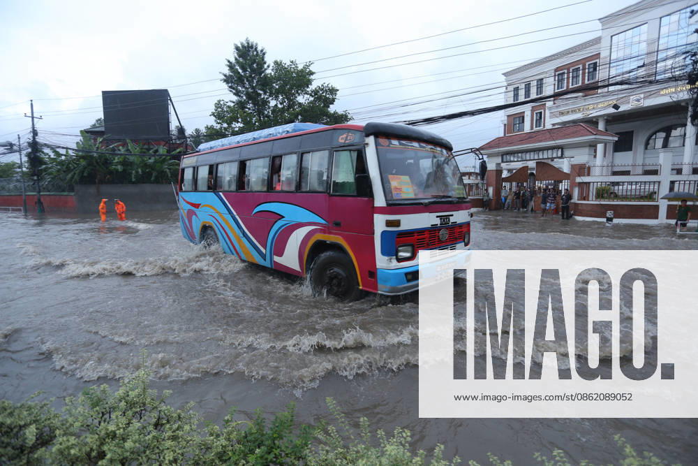 Monsoon Rains Inundate Roads In Central Kathmandu Commuters wade through a waterlogged road after heavy monsoon rainfall inundated the Maitighar Mandala area in Kathmandu, Nepal, on July 19, 2026. Continuous rain caused localized flooding and disrupted traffic and daily life in several parts of the capital, with pedestrians and motorists navigating through floodwaters as the monsoon season continues. Kathmandu Nepal