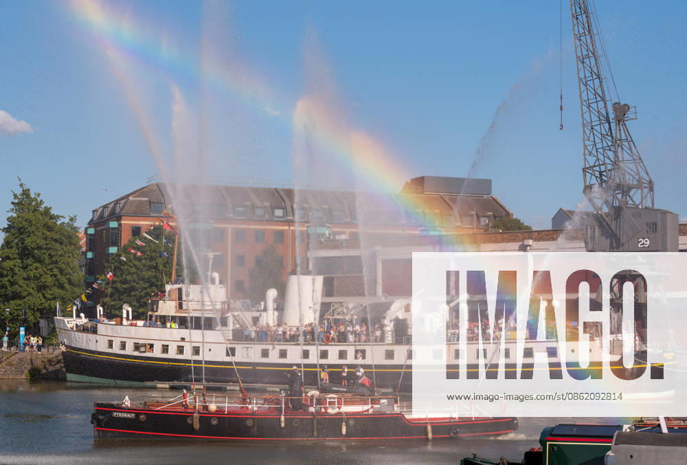 Bristol, UK. A rainbow is seen as the Pyronaut Fire Boat gives a display for the boat parade at Bristol Harbour Festival in warm weather at the end of the latest summer heatwave in the UK. The event includes maritime displays and boats and ships with music, circus and other performances. Bristol UK - ZUMAl94_ 20260719_zaf_l94_020