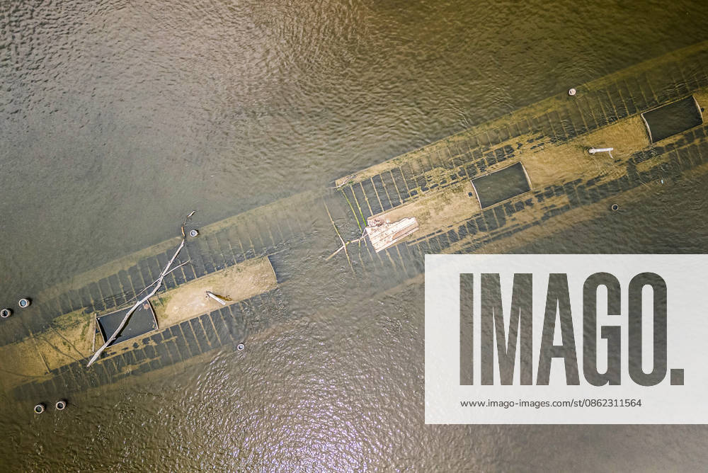 Low water reveals remains of century-old ship on Croatia s Danube An aerial view shows the remains of a ship believed to be more than a century old after record-low water levels in the Danube River exposed the wreck in Opatovac, Croatia, on July 21, 2026. The vessel is believed to have sunk between the two World Wars. DavidxJerkovic PIXSELL