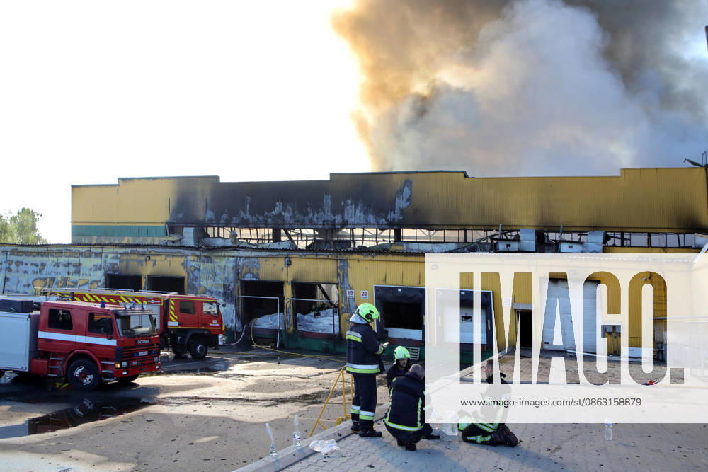 State Emergency Service rescue workers take a break from extinguishing a fire at a civilian industrial and logistics facility caused by an overnight Russian attack, Vyshneve, Bucha district, Kyiv region, Ukraine, August 1, 2026. (Photo by Volodymyr Tarasov Ukrinform) Russia strikes industrial facility in Kyiv region