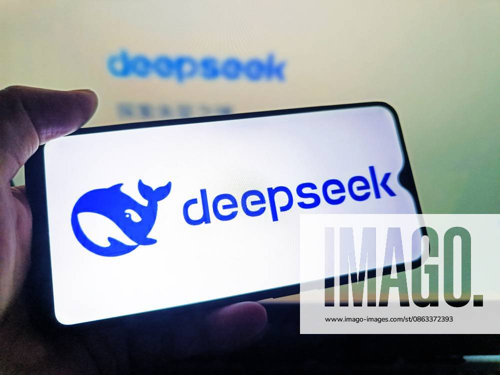 DeepSeek SUQIAN, CHINA - AUGUST 5, 2026 - A netizen is using his mobilephone to view DeepSeek logo and using his computer to view DeepSeek webpage in Suqian, Jiangsu, China on August 5, 2026. Suqian Jiangsu China