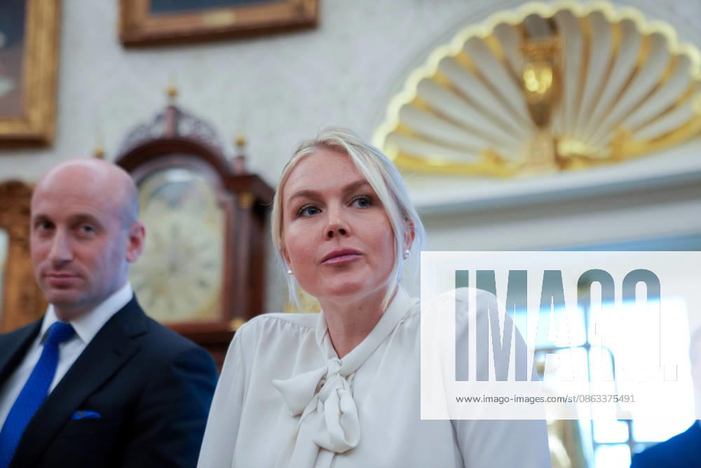 Trump Executive Order Establishing the Presidential Military Spouse Commission WASHINGTON, DC - AUG. 3: Stephen Miller, White House Deputy Chief of Staff for Policy and US Homeland Security Advisor and White House press secretary Karoline Leavitt, right, look on as U.S. President Donald Trump announces an executive order establishing the Presidential Military Spouse Commission on Monday, Aug. 3, 2026 in the Oval Office at the White House in Washington, D.C. Credit: CNP AdMedia Washington District of Columbia United States of America