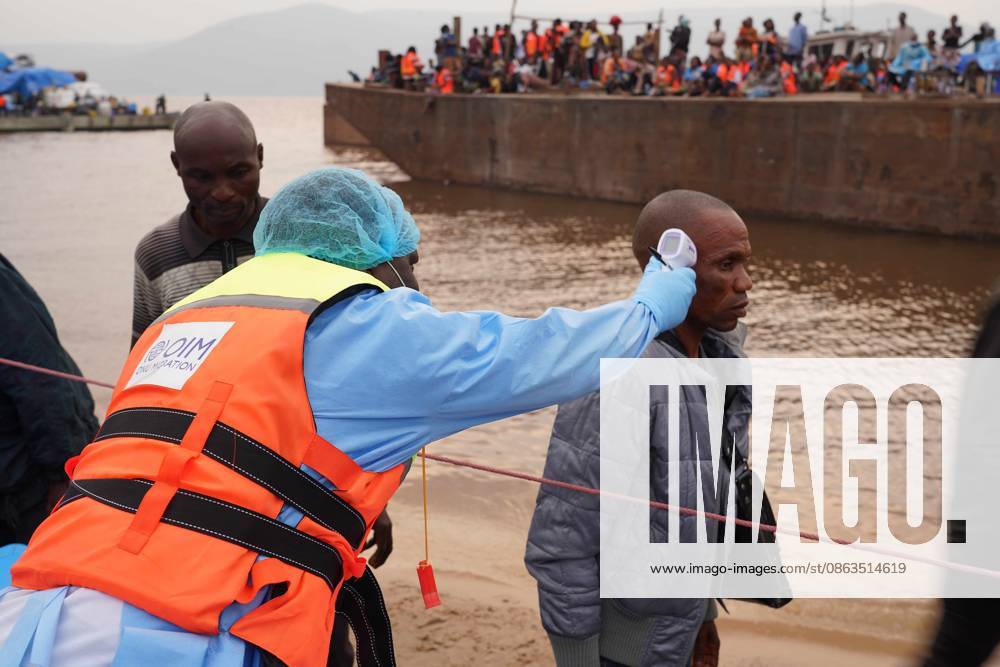 (260807) -- KINSHASA, Aug. 7, 2026 () -- A staff member of the International Organization for Migration (IOM) takes temperature of a passenger from an intercepted boat outside Kinshasa, capital of the Democratic Republic of the Congo (DRC), Aug. 6, 2026. Health authorities in the DRC have intercepted a passenger boat outside Kinshasa following the death of a former passenger suspected of having Ebola, officials said Wednesday. () DR CONGO-KINSHASA-PASSENGER BOAT-EBOLA CASE Xinhua