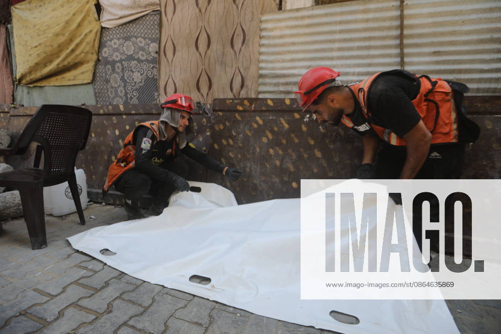 Civil Defense Recovers Bodies from Rubble in Gaza City Palestinian Civil Defense members work to recover bodies from beneath the rubble of the Abu Shamala family home in the Zeitoun neighborhood, east of Gaza City, on August 23, 2026, using a single excavator available to Civil Defense teams in the city. Limited access to equipment and heavy machinery is hampering search and recovery operations and delaying efforts to reach victims and missing people trapped under the rubble. Photo by Bilal Osama apaimages Gaza city Gaza Strip Palestinian Territory 230826_Gaza_BO_00(1).jpeg